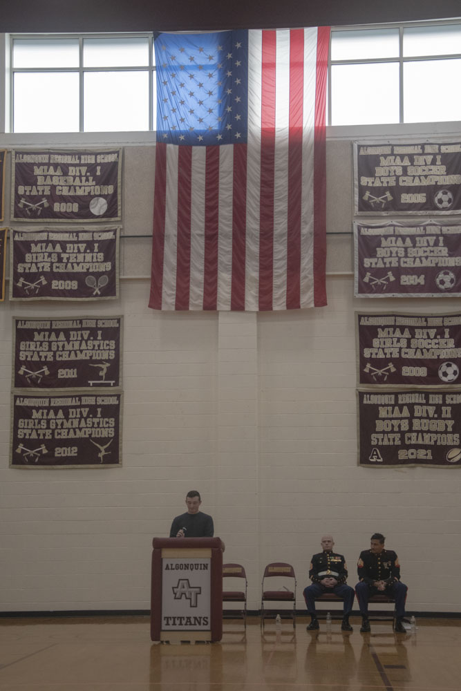 Army Veteran and Class of 2019 graduate Tony Massaglia speaks about his military experiences while under the flag of the United States.