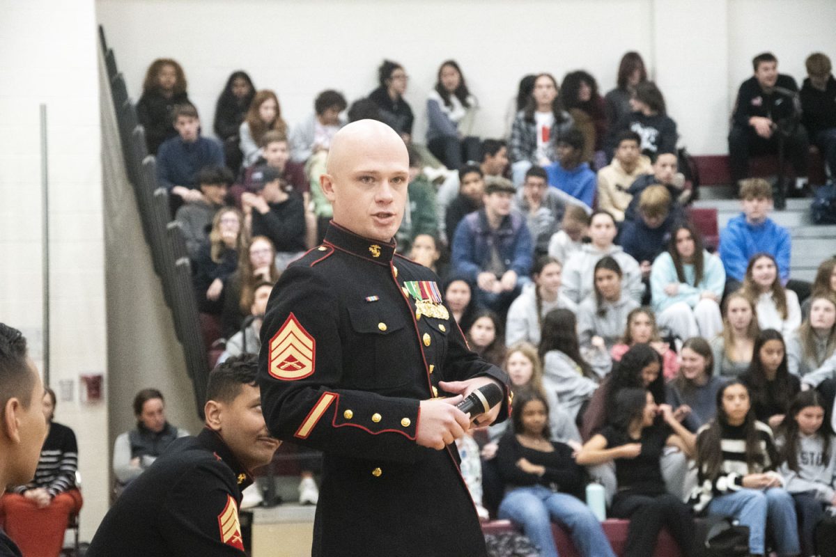 Marine Staff Sergeant Nicholas Lamothe answers a question from World Language teacher Sarah Lawlor.