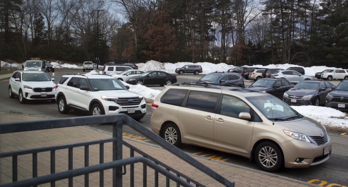Cars line up at the morning drop off area before school on Jan. 12, 2024. Many students have been arriving late to school due to traffic congestion and have had to experience major inconveniences due to bus cancellations and delays.