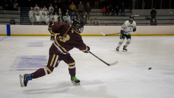 Algonquin junior Betsy Bertonazzi (3) hits the puck down during the Final Four playoff game on March 9, 2024. Algonquin, ranked number five, lost 3-1 to Duxbury, ranked number one.