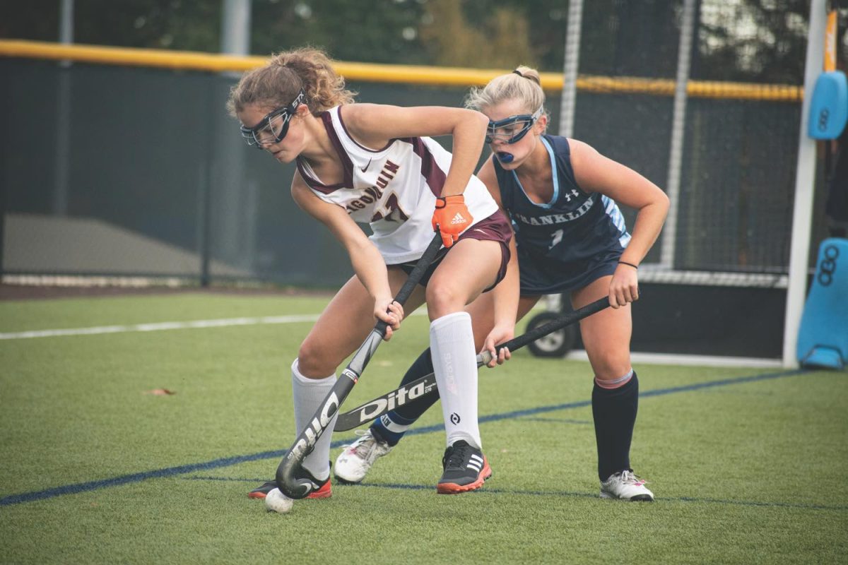 Lindsey Brown defends the ball from the Franklin player at the field hockey game on Oct. 18, 2021.