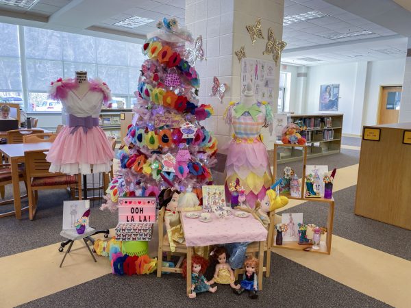 The Arbor Day Tree Decorating event, organized by the Algonquin librarians, invites students and staff members to decorate a fake tree according to the ideas from a childrens book of their choice.