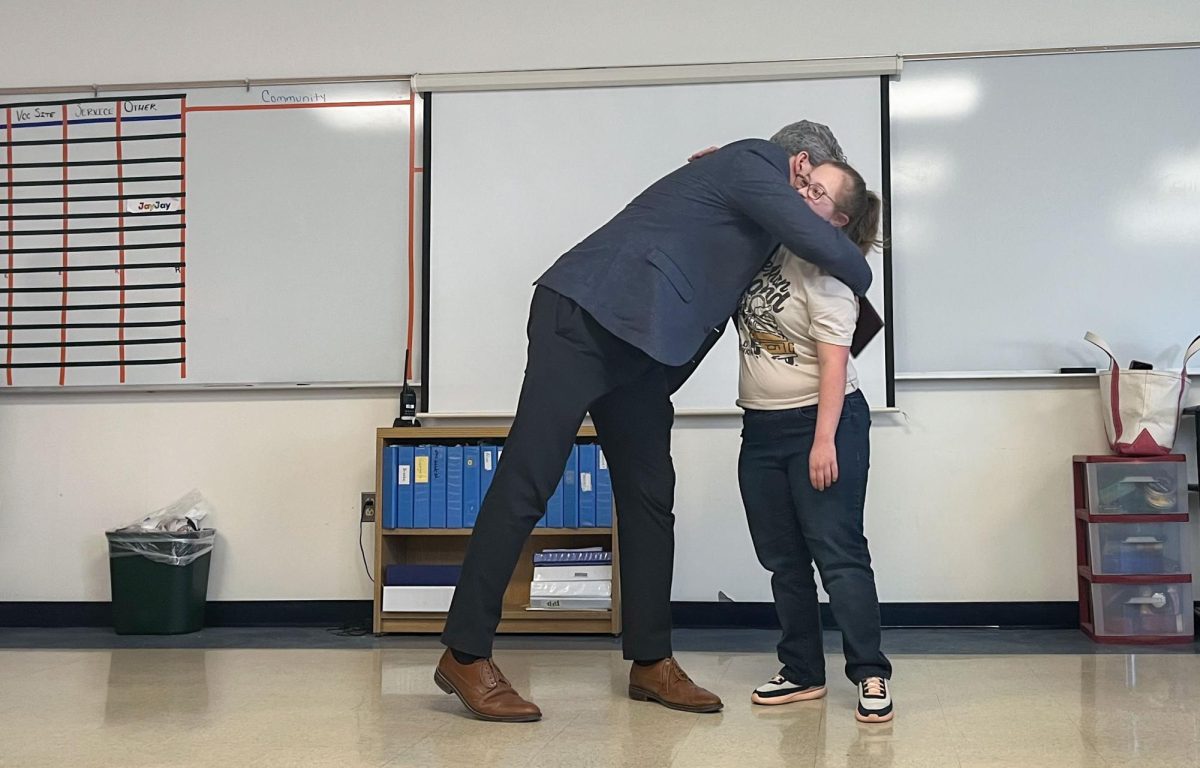 Postgraduate Sofia Roumiantsev hugs Principal Sean Bevan at her CAP graduation on April 26, 2024.