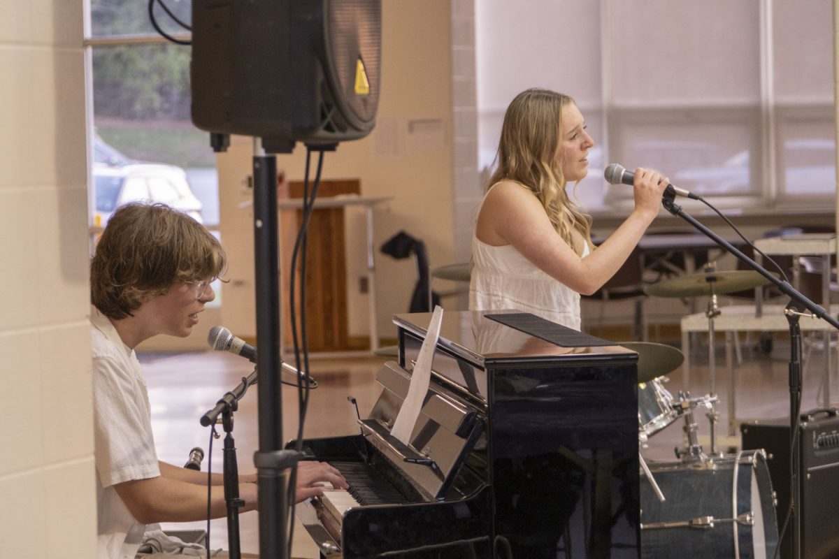 “Till Forever Falls Apart” by Ashe and FINNEAS is performed by freshman Ben Dane and sophomore Sydney Roy at the Tri M Coffeehouse on May 1, 2024.