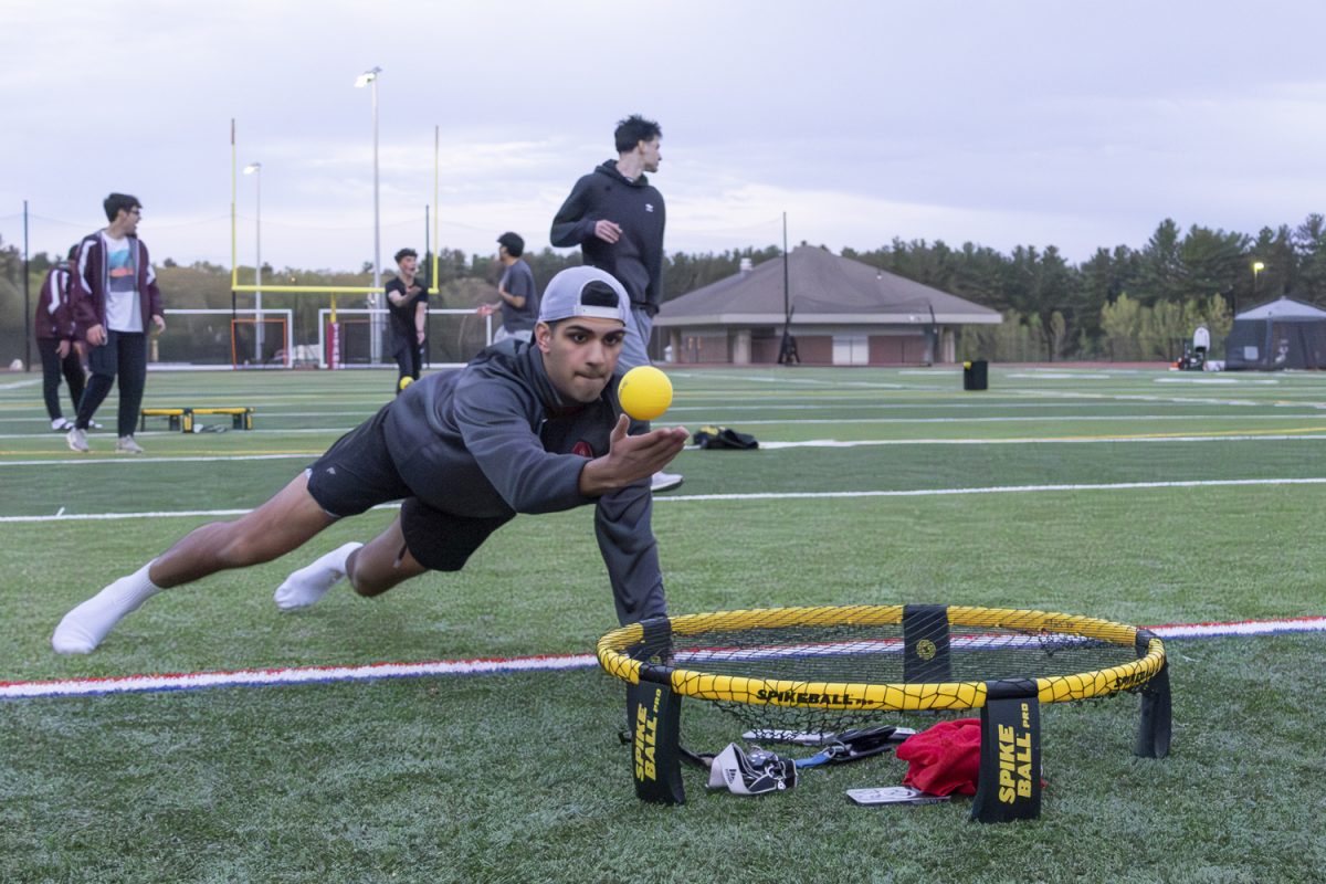 Senior Jeh Mody dives for the ball in a spike ball game during the Relay for Life on May 10, 2024.