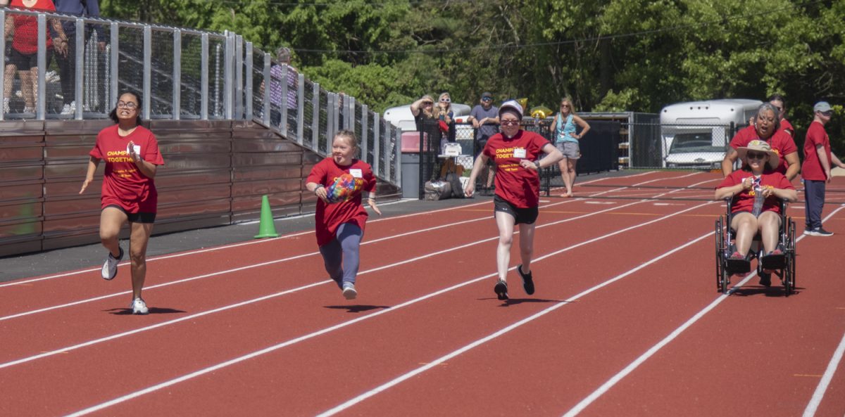 From left to right: post-graduates Norah Shaikh, Olivia Cheney, Julia Cobb and Robin Snow run the 50-yard dash at the Titan Games on May 22. 
