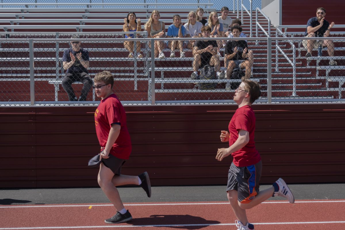 At the Titan Games on May 22, juniors Landin Youssef (left) and Liam Fitzgerald (right) run the 50-yard dash.