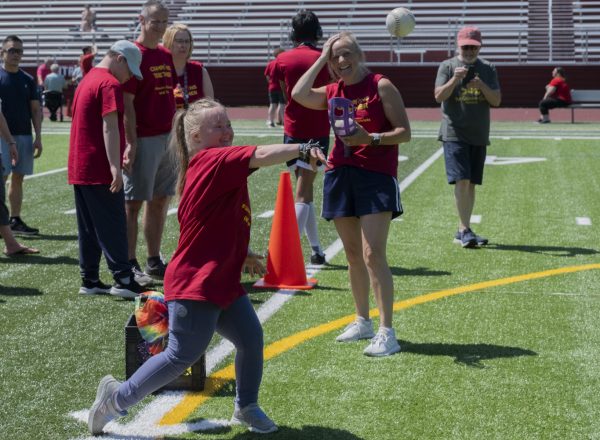 At the Titan Games on May 22, post-graduate Olivia Cheney throws the ball with force during the ball toss.