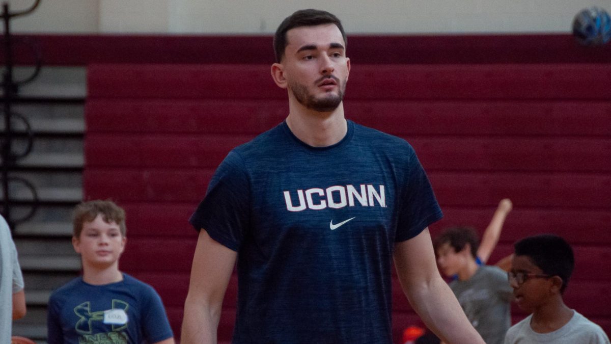 UConn basketball player Alex Karaban coaches student athletes during the Alex Karaban Basketball Camp on August 11, 2024.