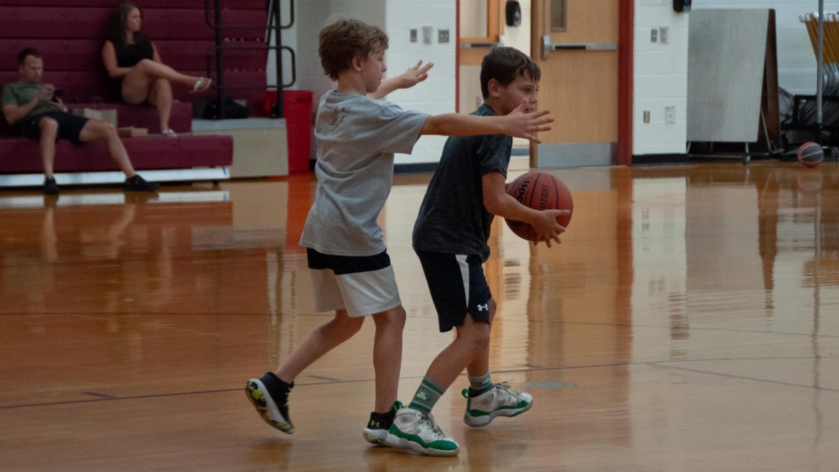 In the Algonquin gym, young basketball players learn new skills as part of the Alex Karaban Basketball Camp.