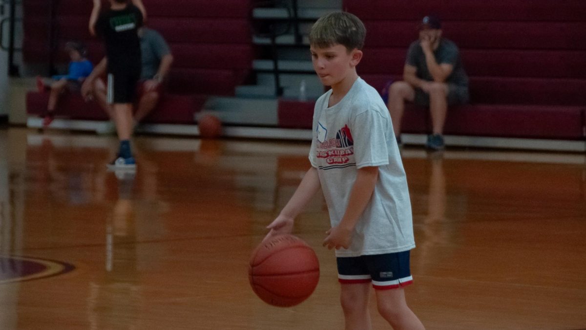 In the Algonquin gym, young basketball players learn new skills as part of the Alex Karaban Basketball Camp.