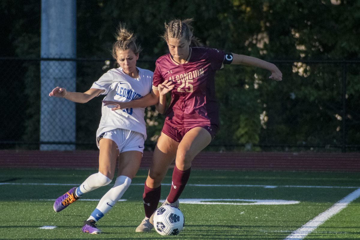 During a 4-0 win against Leominster on Sept. 10, senior captain Katie Richmond (25) defends the ball from her opponent.