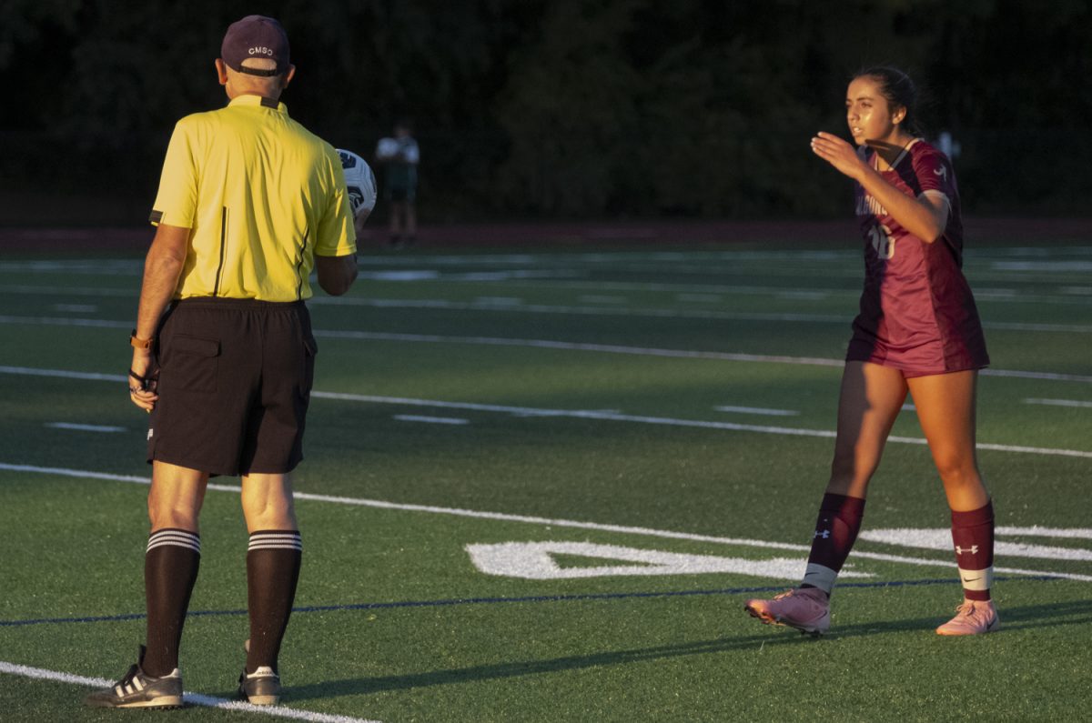 During the girls' varsity soccer game against Leominster on Sept. 10, sophomore Caity O’Hearn talks to the referee about his call.