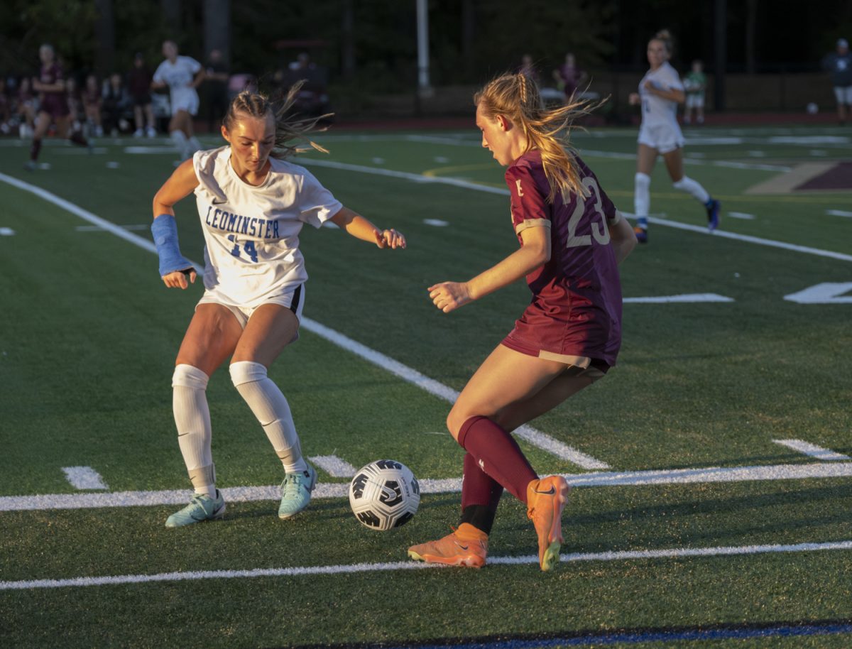 During the girls' varsity soccer game against Leominster on Sept. 10, senior captain Mary Cate Megan tries to keep the ball away from the opposing team in a face off.