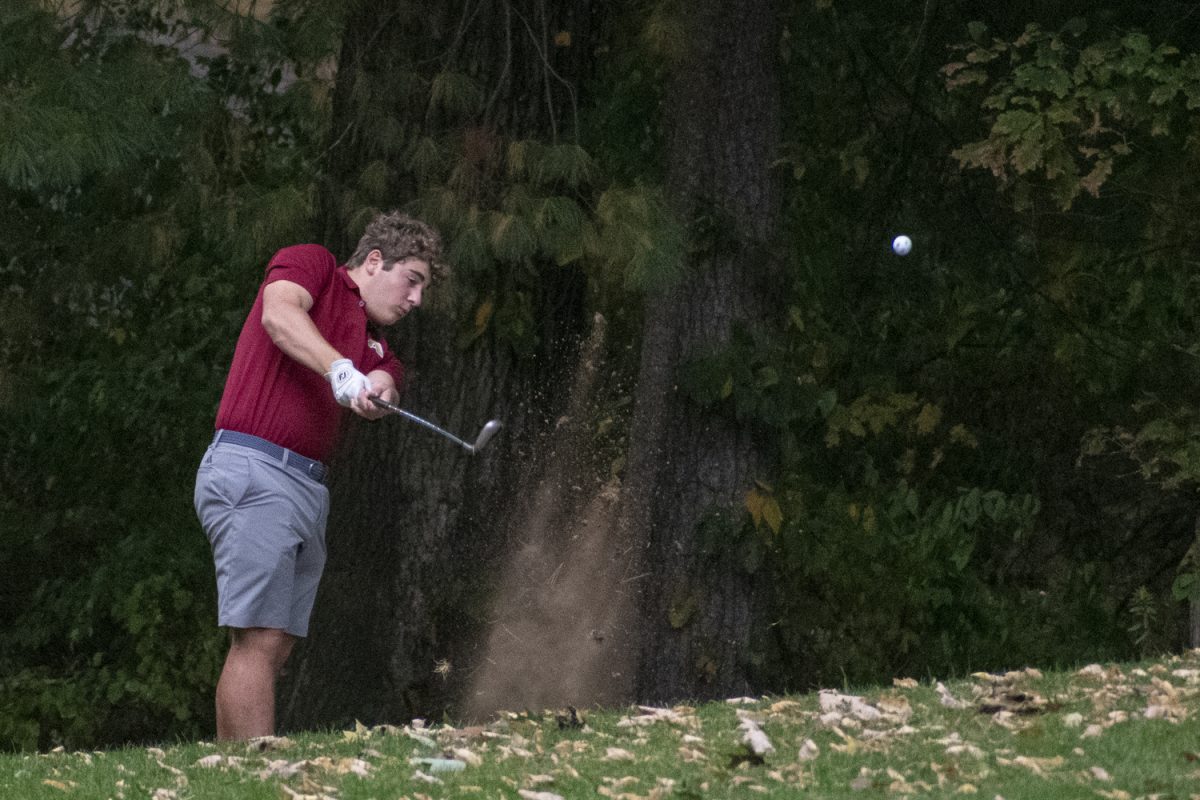 During their winning match against Leominster, junior Domenic Serra chips up the ball and brings up some sand on Sept. 19.