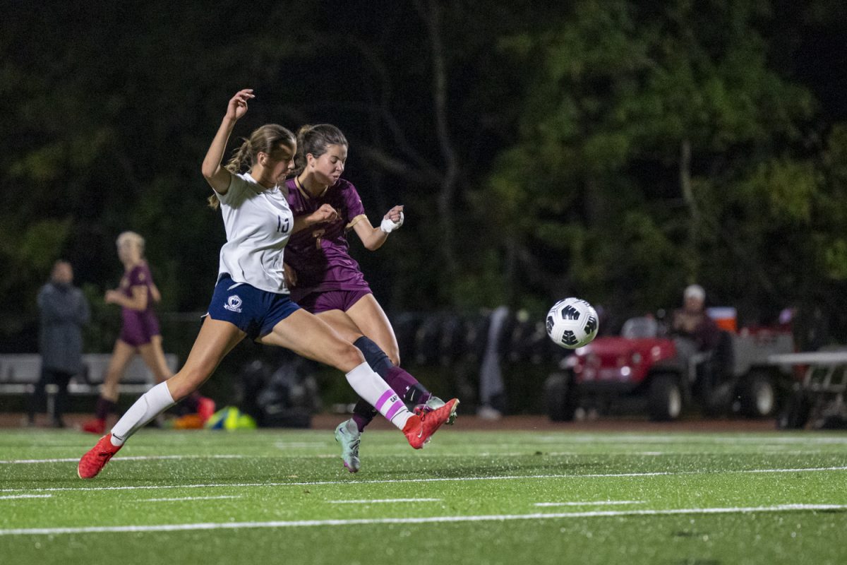 During their 3-1 win against Westborough on Sept. 24, Algonquin senior Emmi Hamel (7) fights against Westborough senior Regan Sullivan (13).