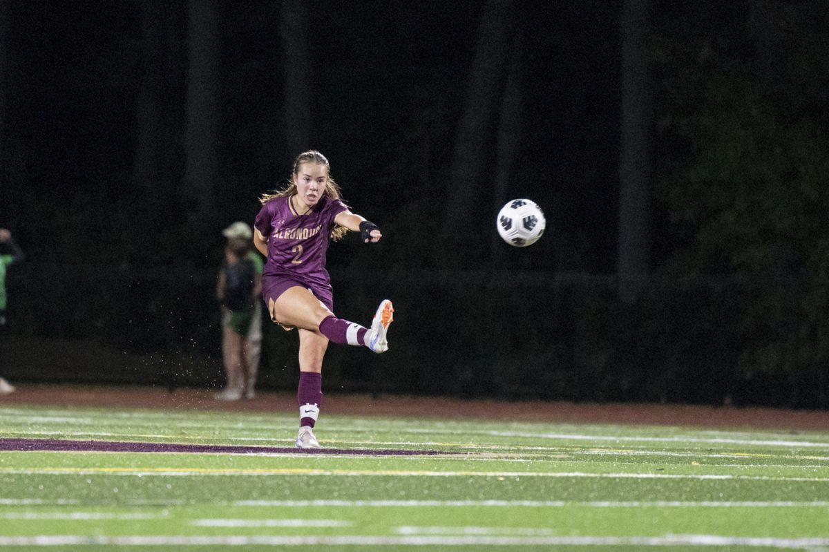 Junior Ella Timmins (2) kicks the ball up the field on Sept. 24.