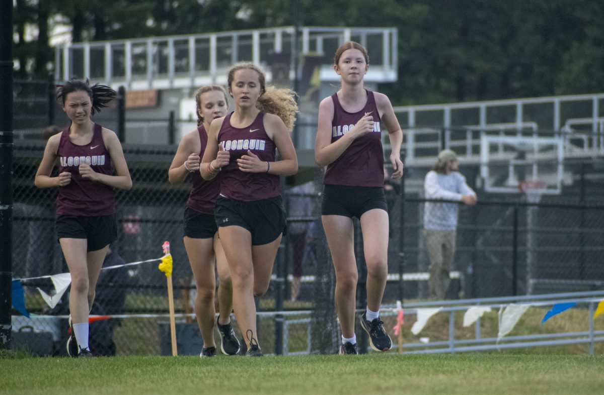 From left to right, sophomore Amy Li, freshman Heather Blore, and juniors Lana Ingerslev and Ella Behrens run together during their home cross country meet at on Sept. 24.