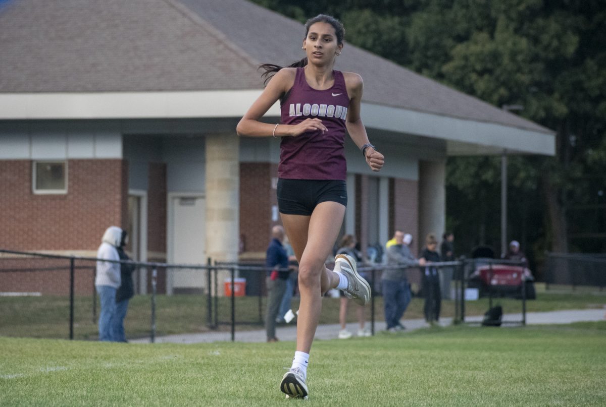 Sophomore Tanvi Mehta finishes the race, placing first among Algonquin runners.