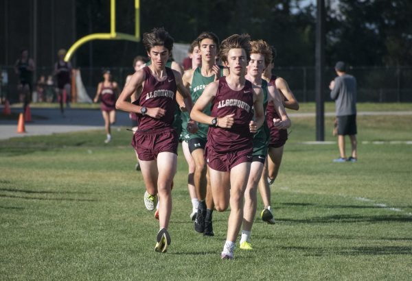 Sophomore Stephen Green (left) and senior Jonah Gould (right) lead the race at the start of their second lap during the boys' cross country meet on Sept. 24.