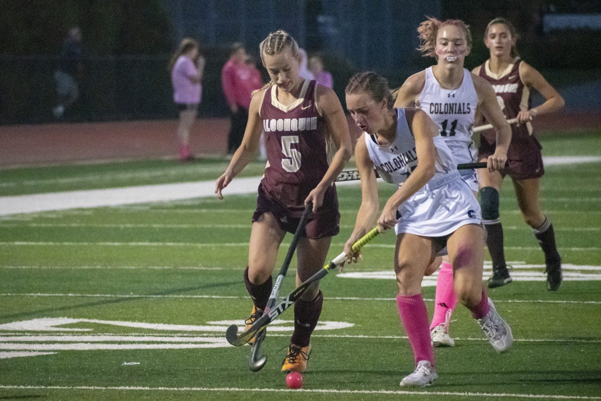 At the winning game, junior Taylor Mieth runs towards the ball, fighting for posession against the opposing Shrewsbury player on Oct. 2.