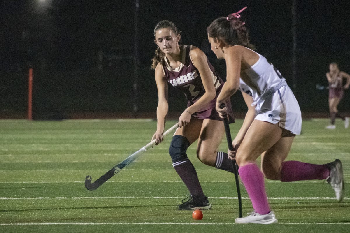 Senior Laney Halsey attempts to steal posession of the ball from a Shrewsbury opponent at the 2-0 winning game on Oct. 2.