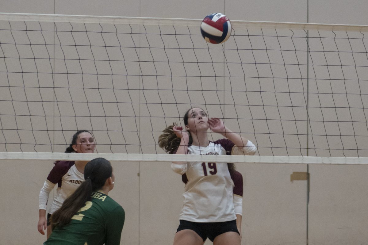 During Algonquin's 3-0 win, senior Ella Poultney (19) watches the ball, waiting to see if it will fall to Algonquin's side of the court.