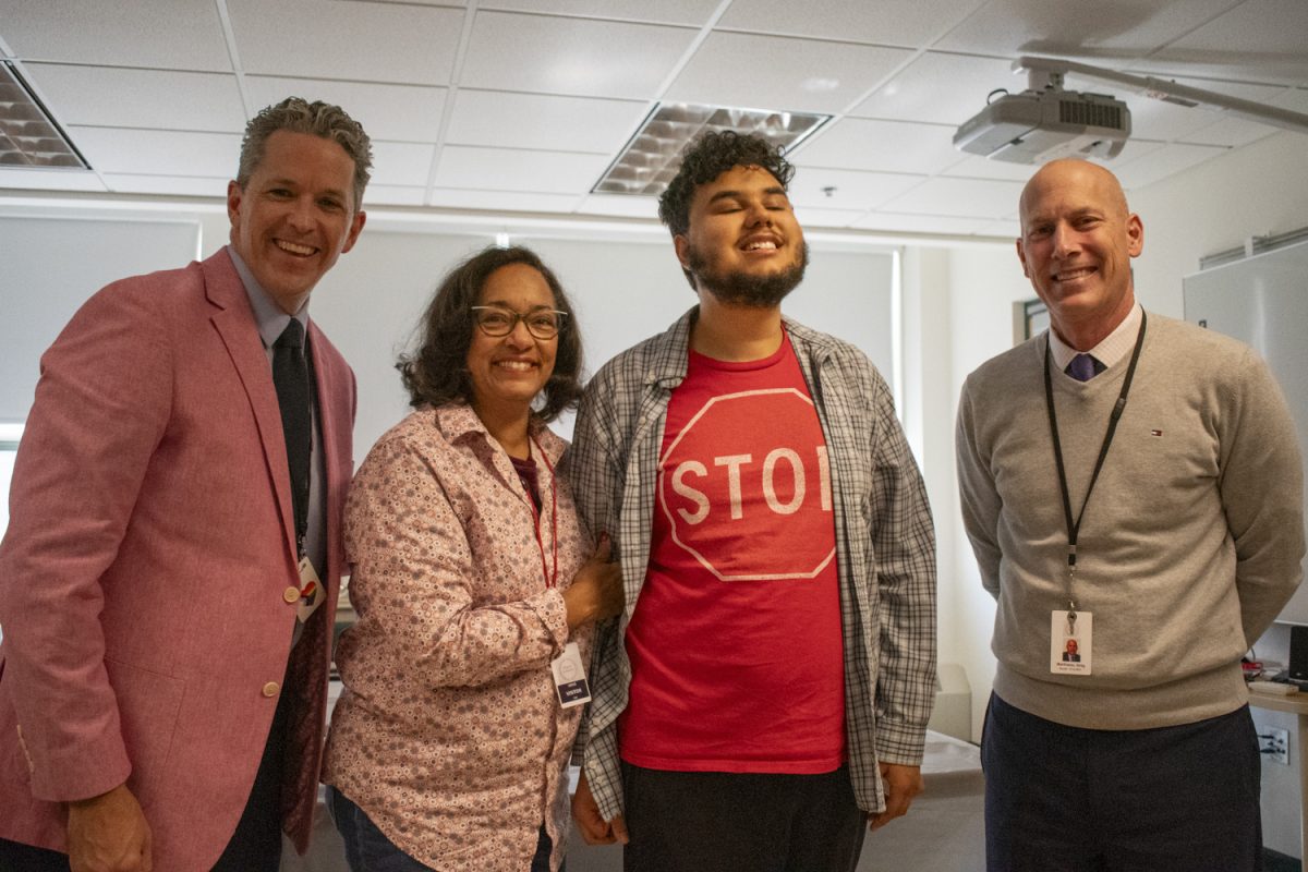 From left to right, principal Sean Bevan, Mondarres' mother Carla Carten, CAP Graduate Daniel Mondarres and superintendent Gregory Martineau pose for a picture during Mondarres' CAP Graduation on Oct. 11.