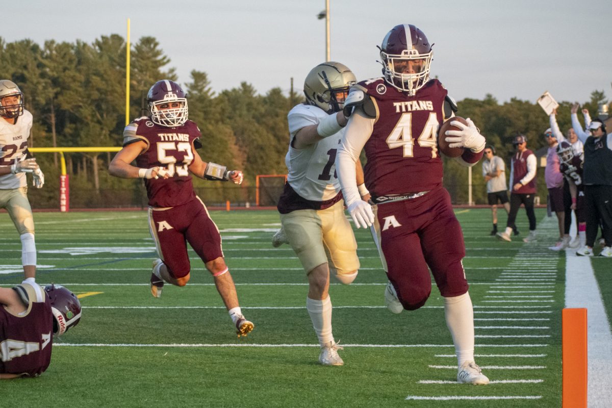 Senior Owen Ellsworth (44) scores the first touchdown of Algonquin's winning game against Shepherd Hill.