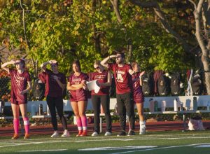 Girls' soccer coach Chris Kirwan reacts to a referee's call during the team's 3-1 win against Hingham on Oct. 19.