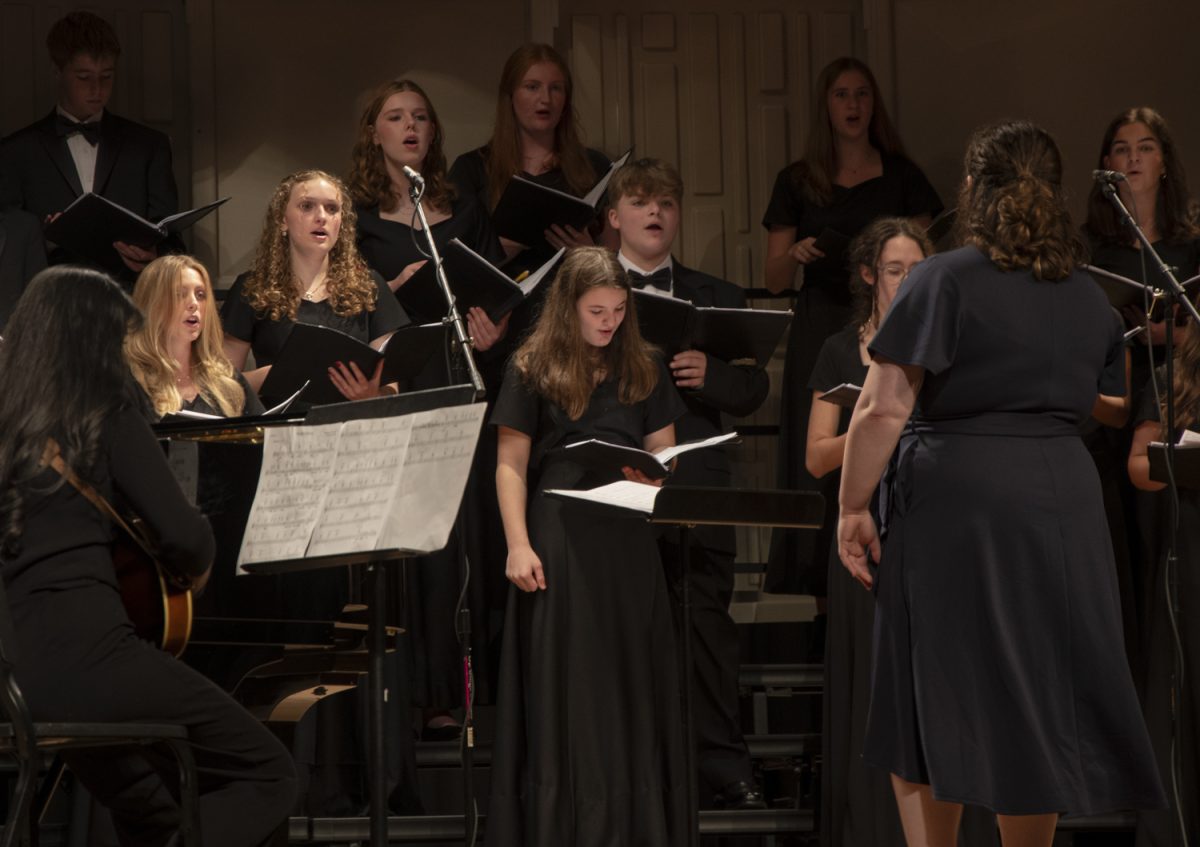 The Algonquin Concert Choir sings “Shady Grove” at the Fall Choral Concert on Oct 22. “Shady Grove” is a traditional folk song that the group sings accompanied by pianist Michael Kregler, and senior Akshaya Pugazendhi on the mandolin.