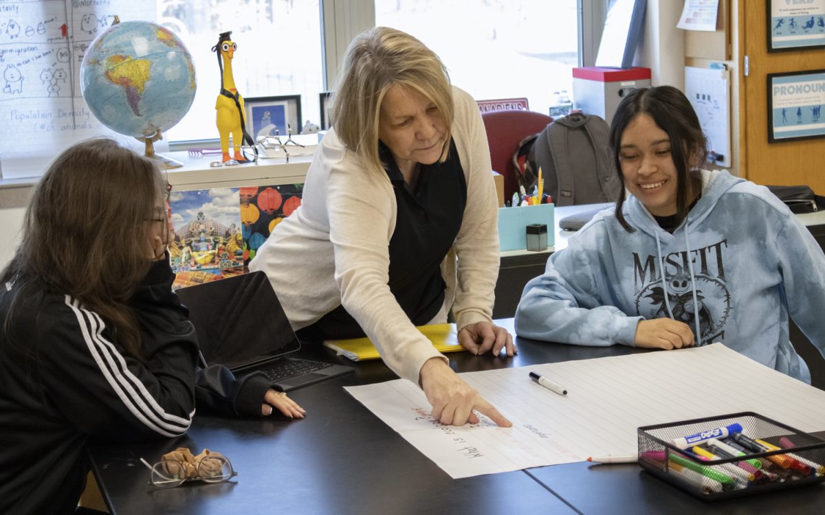 Sandra Bunsick is a new ELD teacher at Algonquin. During her lesson, Bunsick makes a poster about environments, organisms and habitats on Oct. 23, 2024.