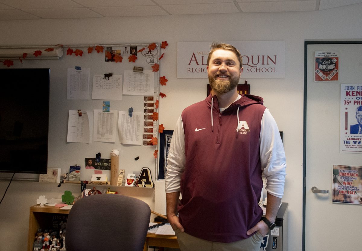 Jon Cahill, the football coach and recently a full time teacher at Algonquin, prepares his classroom for the upcoming school day on the morning of Oct. 25, 2024.