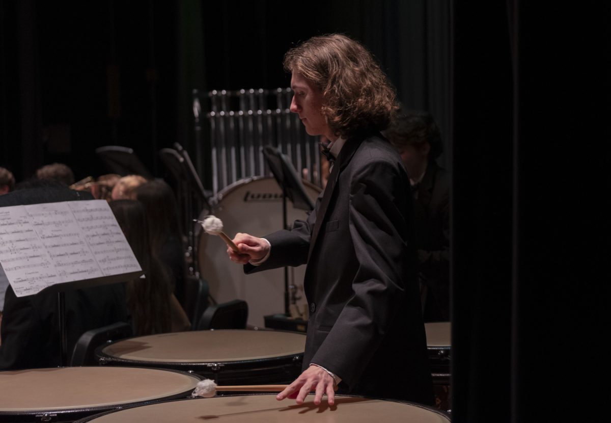 Junior Thomas Schuler plays the drums during “Theron’s Lullaby”  by Keane Southard at the ARHS Fall Instrumental Concert on Oct. 30.