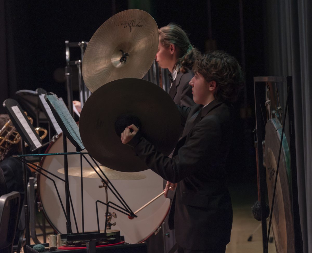 Sophomore Everett Richman plays the cymbals during “Longford Legend” at the ARHS Fall Instrumental Concert on Oct. 30.