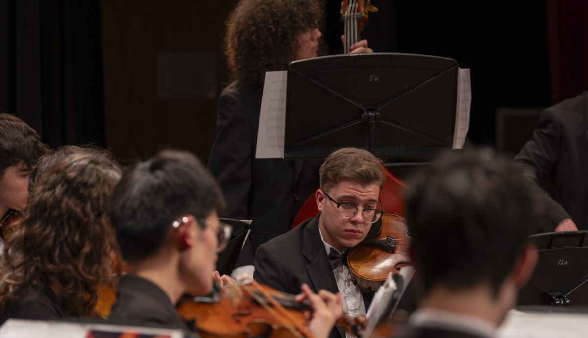 Senior Joao Gomes de Andrade plays “Incantations” by Richard Meyer on the viola with the String Orchestra during the ARHS Fall Instrumental Concert on Oct. 30.