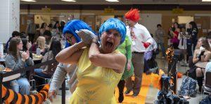 Special Education Aide Beth Mazzola, dressed as Joy from “Inside Out 2”, leads the rest of the Special Education Department, dressed as the movie’s other emotions, down the runway at the annual Halloween costume contest. 