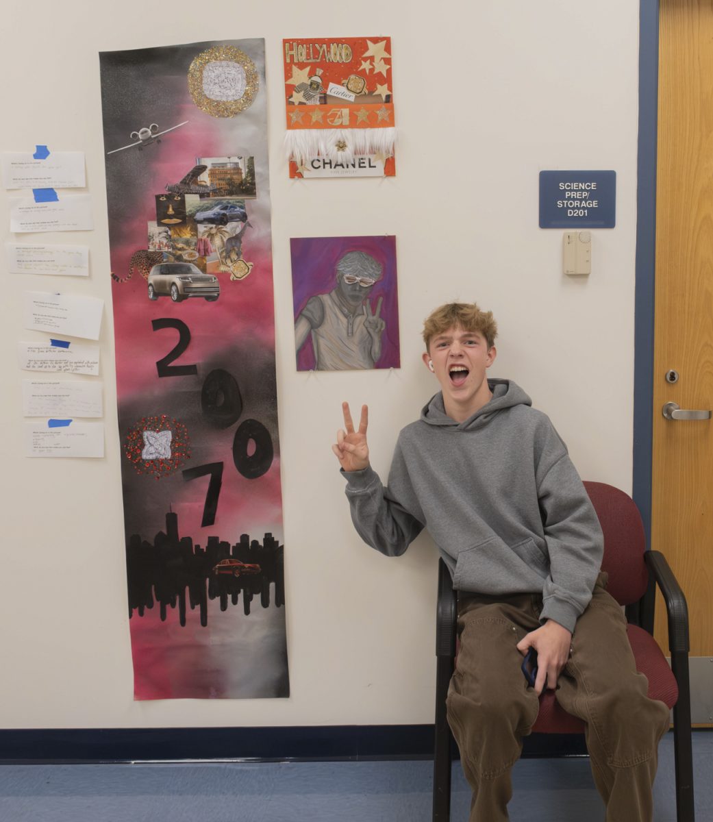 Senior Drew Sbordone poses with his piece called “Im expensive.”