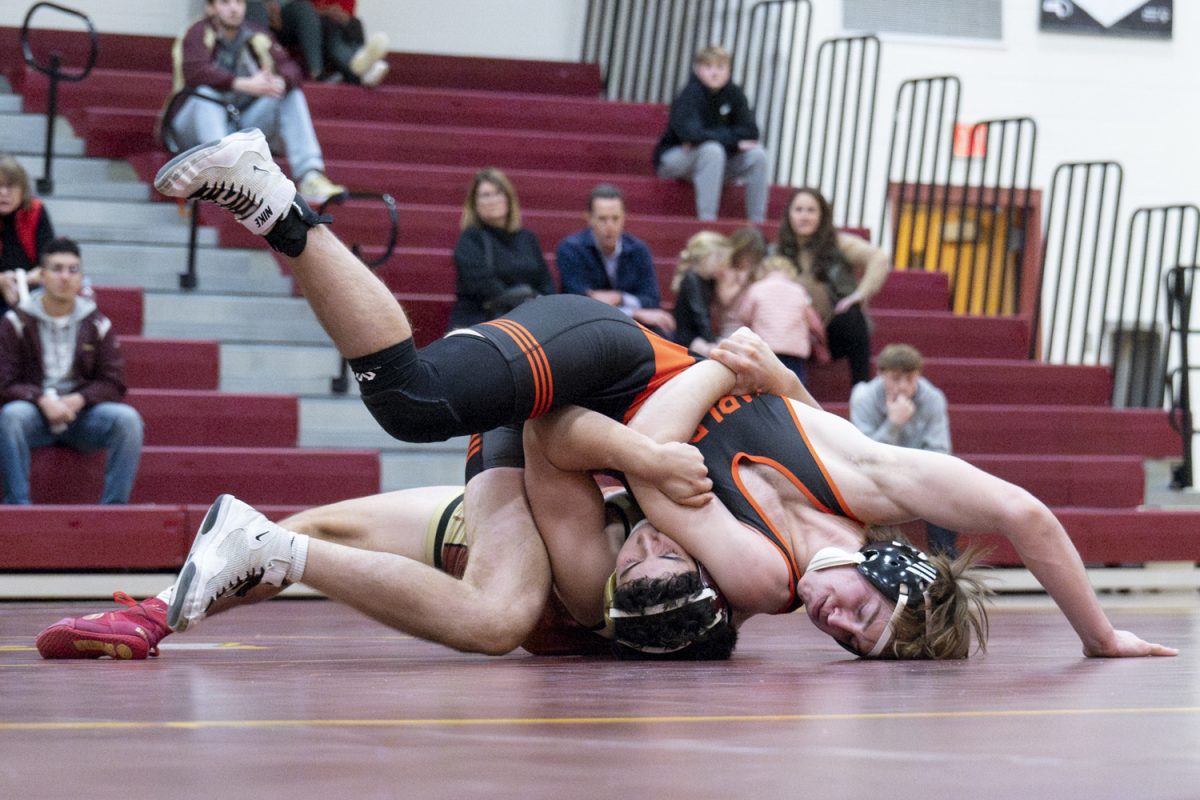 During the wrestling match on Dec. 18 against Marlborough, Algonquin senior Paulo Knapp is pinned against the mat by his opponent. The match ended in a 54-26 Algonquin loss.