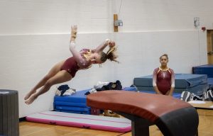 Junior Kiera Akus attempts her second vault at a home gymnastics meet. The competition between Algonquin, Shrewsbury and Groton-Dunstable on Jan. 2 resulted in a win for Algonquin.