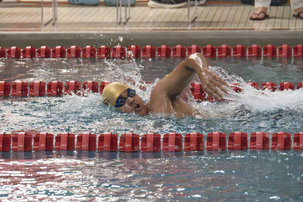 During the second heat of the ninth event, senior Rushil Singh swims the third leg of the 200m freestyle relay, swimming 50 yards doing the freestyle stroke.