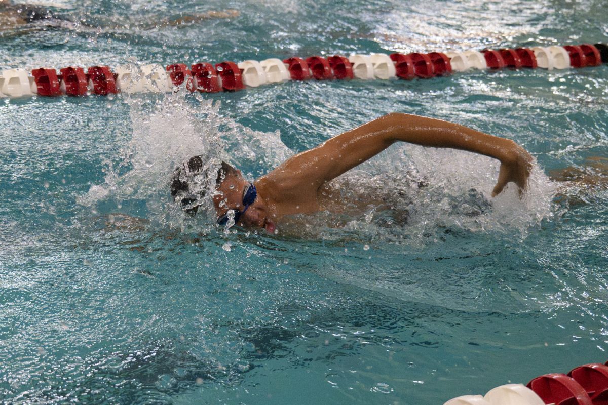 Freshman Osi Mokwunye swims the second leg of the 200m freestyle relay, swimming 50 yards of the relay. During the Jan. 2 meet against Shrewsbury, the Algonquin boys' swim and dive team wins 101-72.