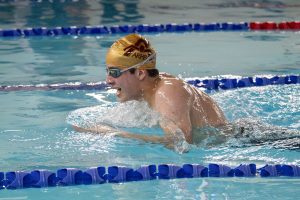 During a double win for Algonquin, junior Simon Linden swims the breast stroke. Both the girls' and boys' teams beat Westborough; the final score for the girls' was 92-76 and the final score for the boys' was 92-77.