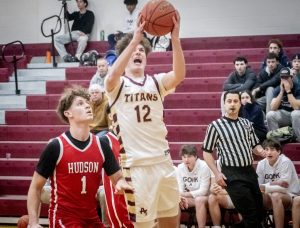 Junior Dylan Poirier narrowly misses being blocked on a layup attempt during the fourth quarter of the game. The home game on Jan. 7 results in a 62-46 win for Algonquin.