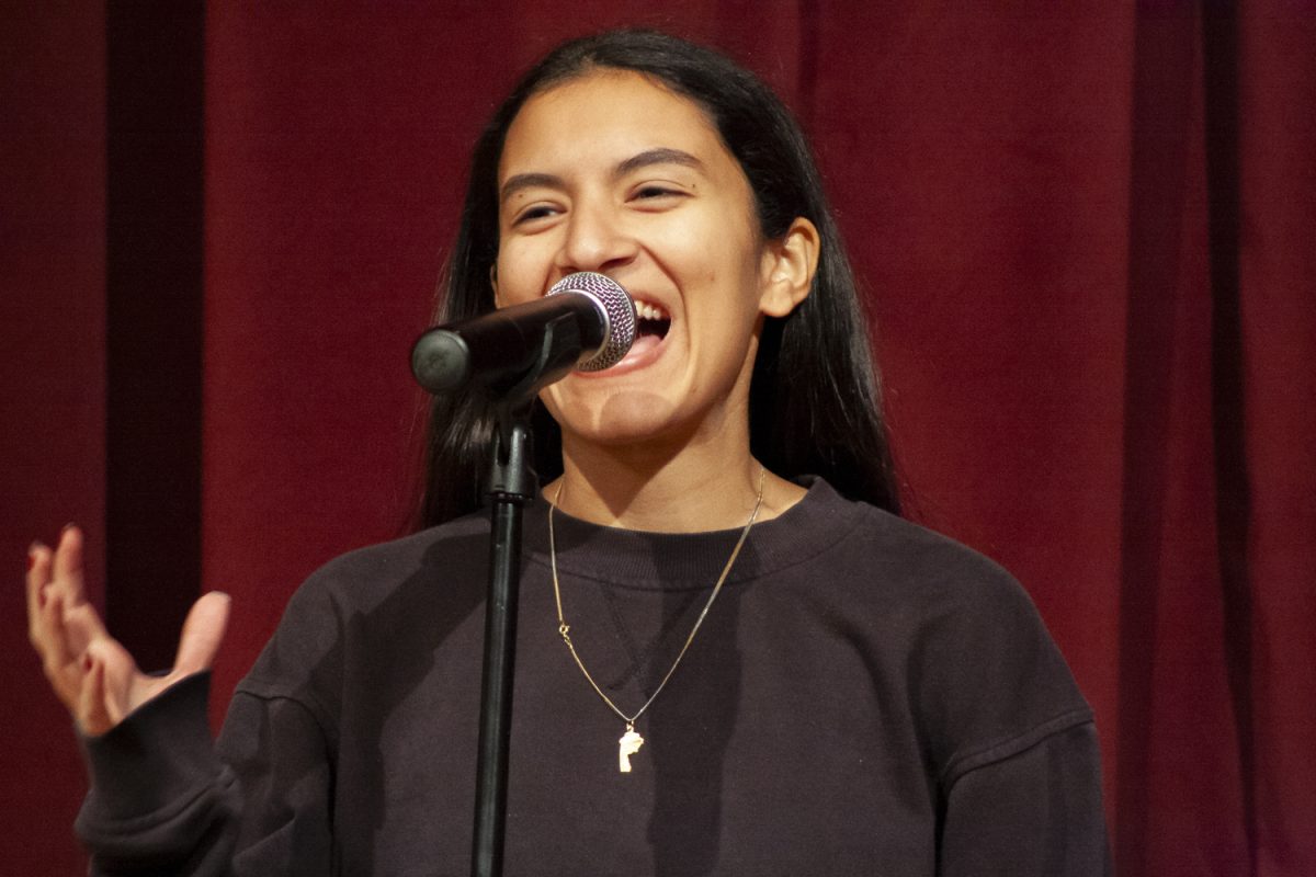 Expressively delivering her poem, senior Karma Bebawy performs her first poem titled "In Praise of My Bed" by Meredith Holmes during the Poetry Out Loud Algonquin finals on Jan. 9. Bebawy won the Algonquin finals, officially moving on to the state semi-finals.