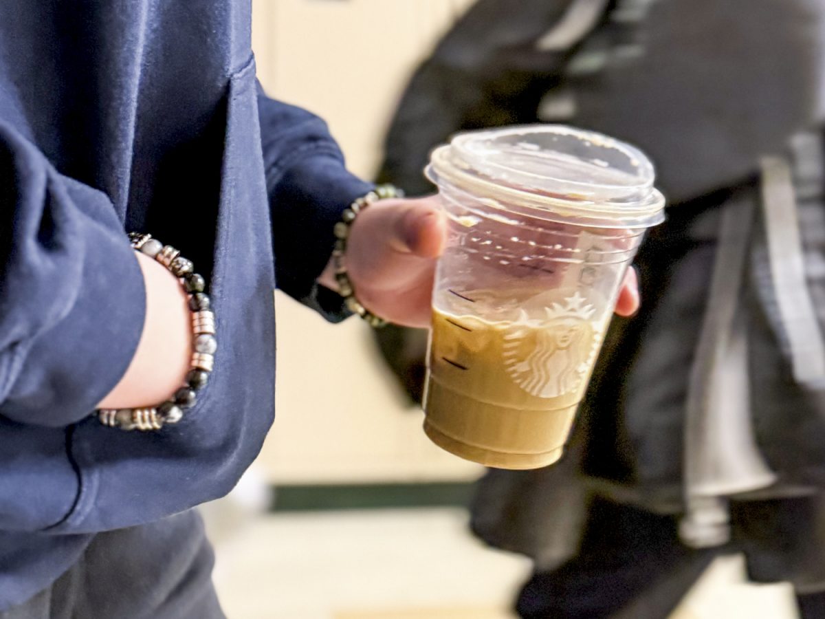 Freshman Kiera Silvia walks through the halls with a grande iced latte in hand. A typical Starbucks Iced Latte has 150 milligrams of caffeine.