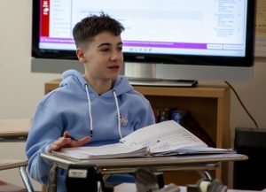 Freshman Gianni DiRenzio participates in Brian Kellet's US History I class by recapping what he and his classmates did before February break during A block on Monday, Feb. 24, 2024.