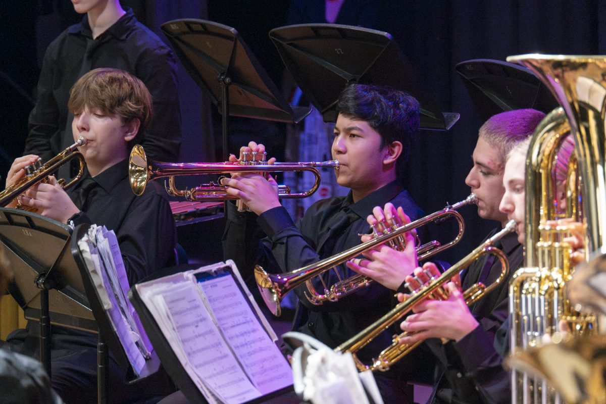 Freshman Devin Bajracharya performs the trumpet with the Symphonic Band at the MICCA showcase on April 2.