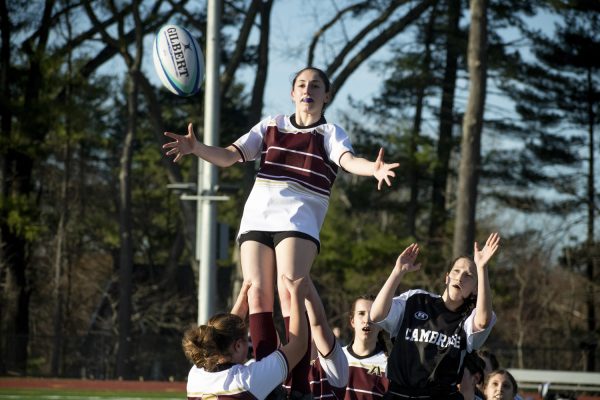 Junior Nina Boeckeler prepares to catch a lineout throw. In the game against Cambridge Rindge &amp; Latin School, the Algonquin girls' rugby team won 35-15.