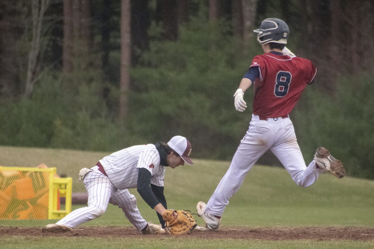 Senior Michael Chiocco tags out a Westborough runner at first base during baseball's 3-1 win on April 11.